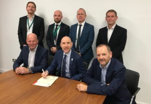 Members of the industry council sign the charter supporting connected competence