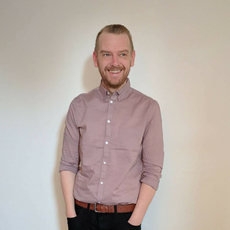 The ECITB's Senior Service Designer Steve Rick stands hands in pockets staring away from camera