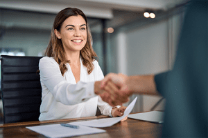 Woman shaking a man's hand in agreement