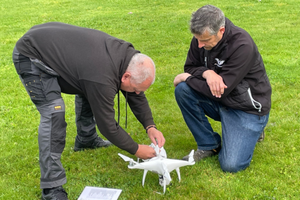 Julian Hoile with Global Drone Training Director Jonathan Carter inspecting a drone
