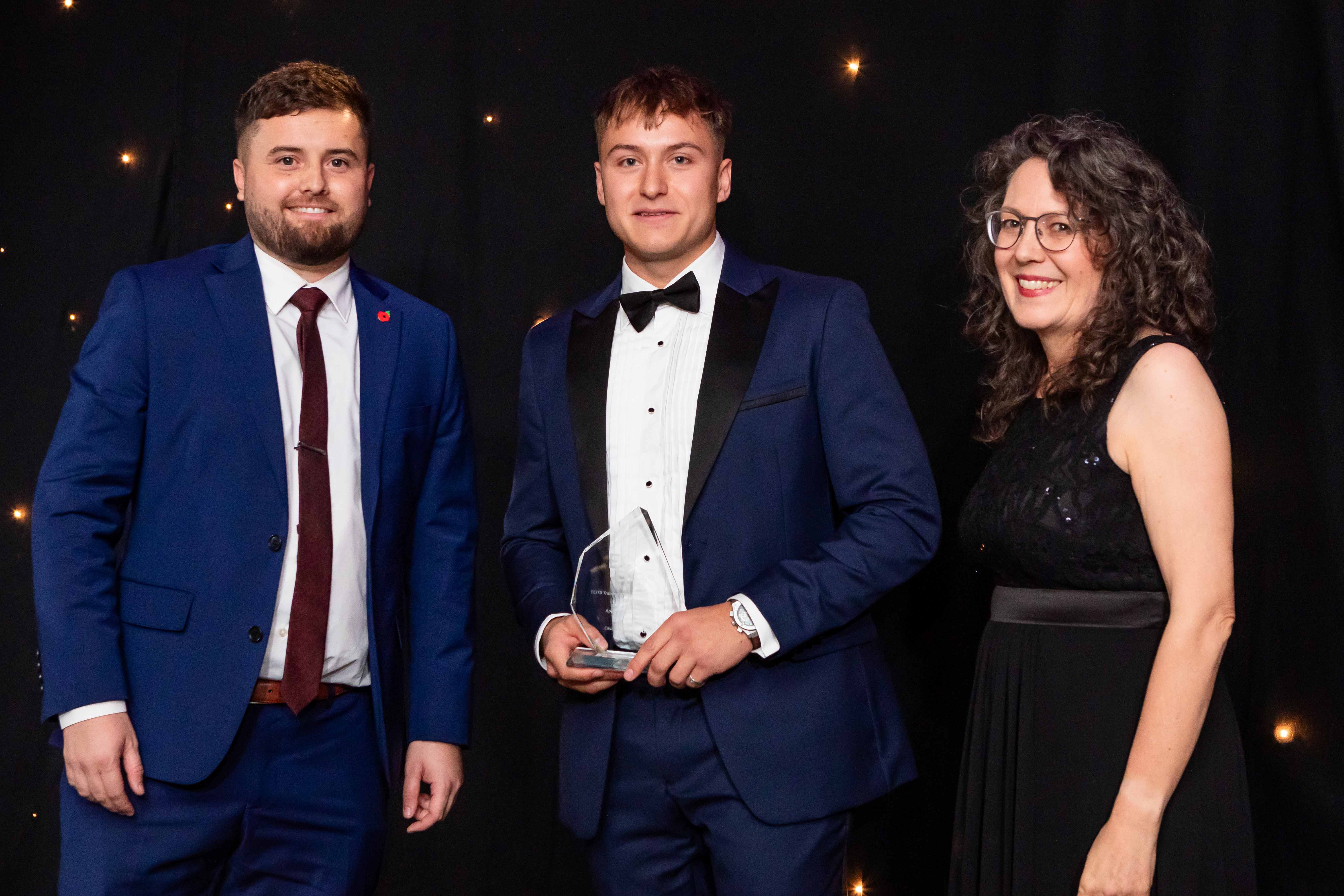Luke Turner from Cavendish Nuclear reveiving the award from James Bunyan of sponsor C&P Engineering and host Kate Bellingham