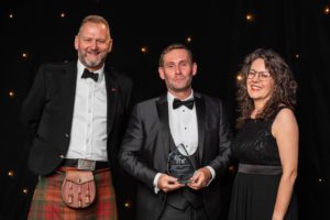 Sandy Bonner receiving his award from ECITB COO Andy Brown and host Kate Bellingham