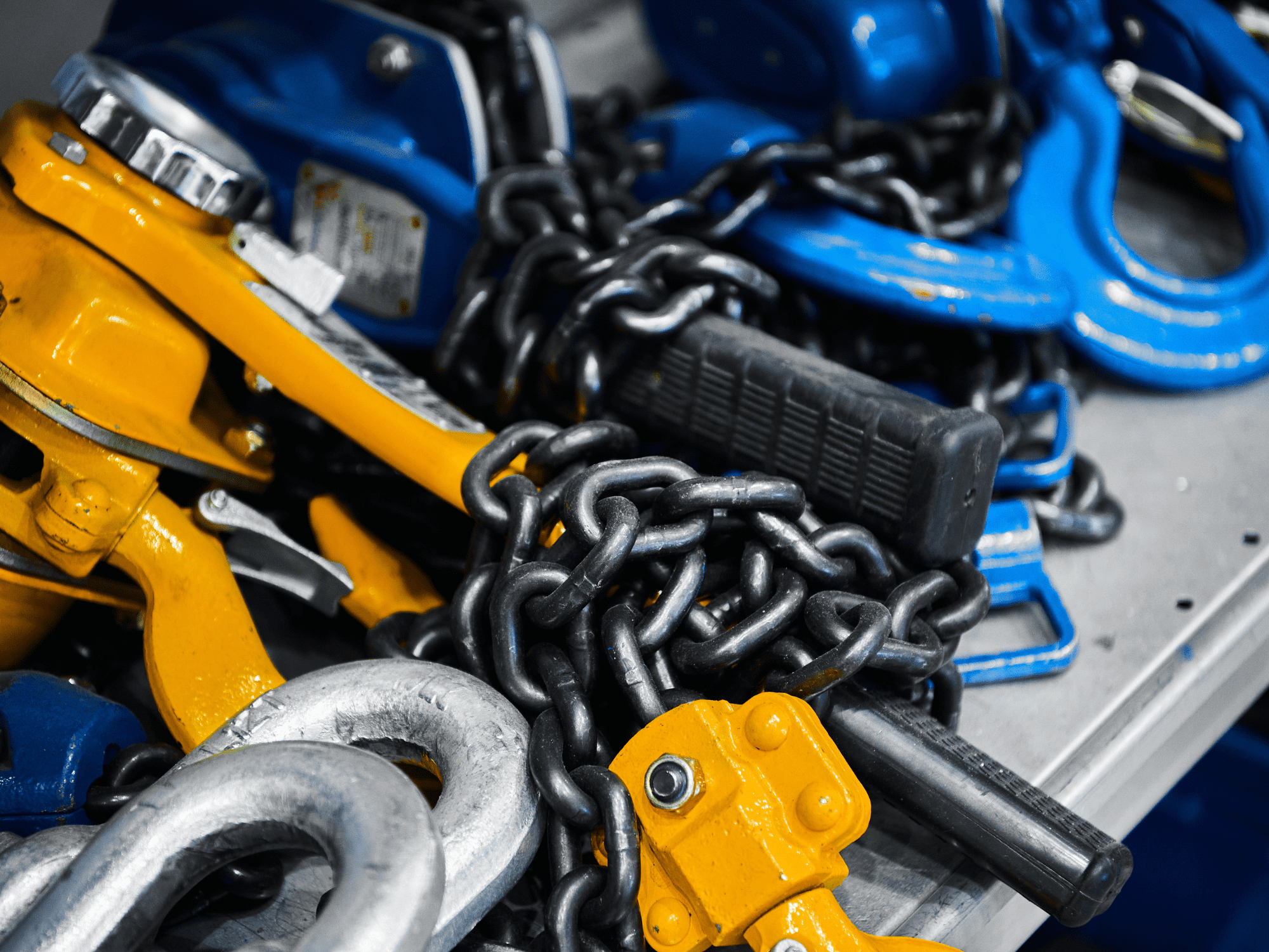 Erecting And Rigging Blue And Orange Equipment And Chains. Appointed Person Moving Loads