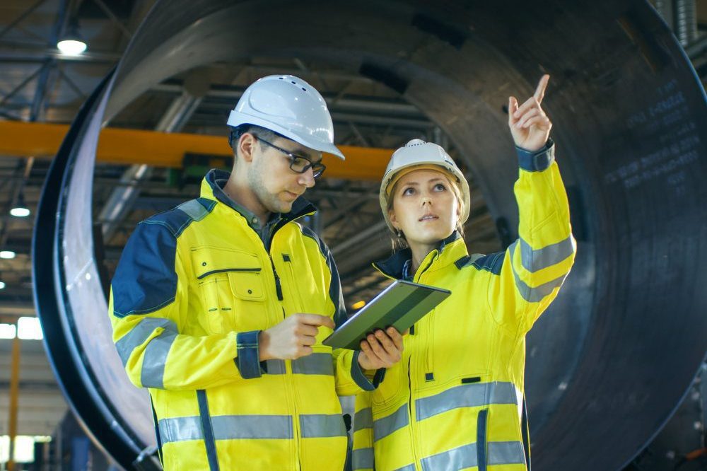 A Man And A Woman In White Hard Hats And Yellow Jackets  Aspect Ratio 1200 800