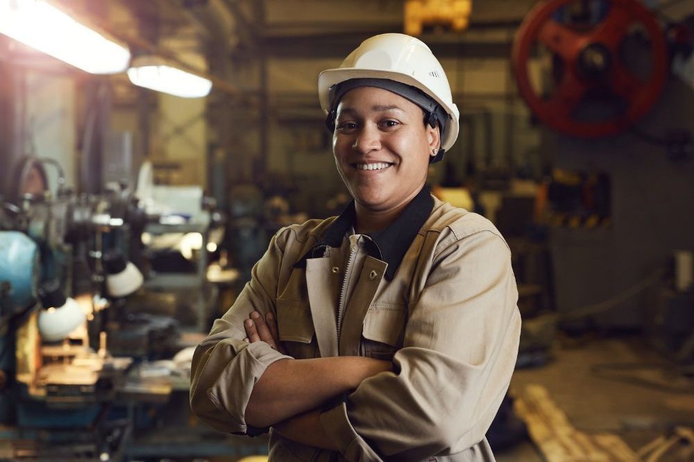 A Woman Working In A Factory Aspect Ratio 1200 800