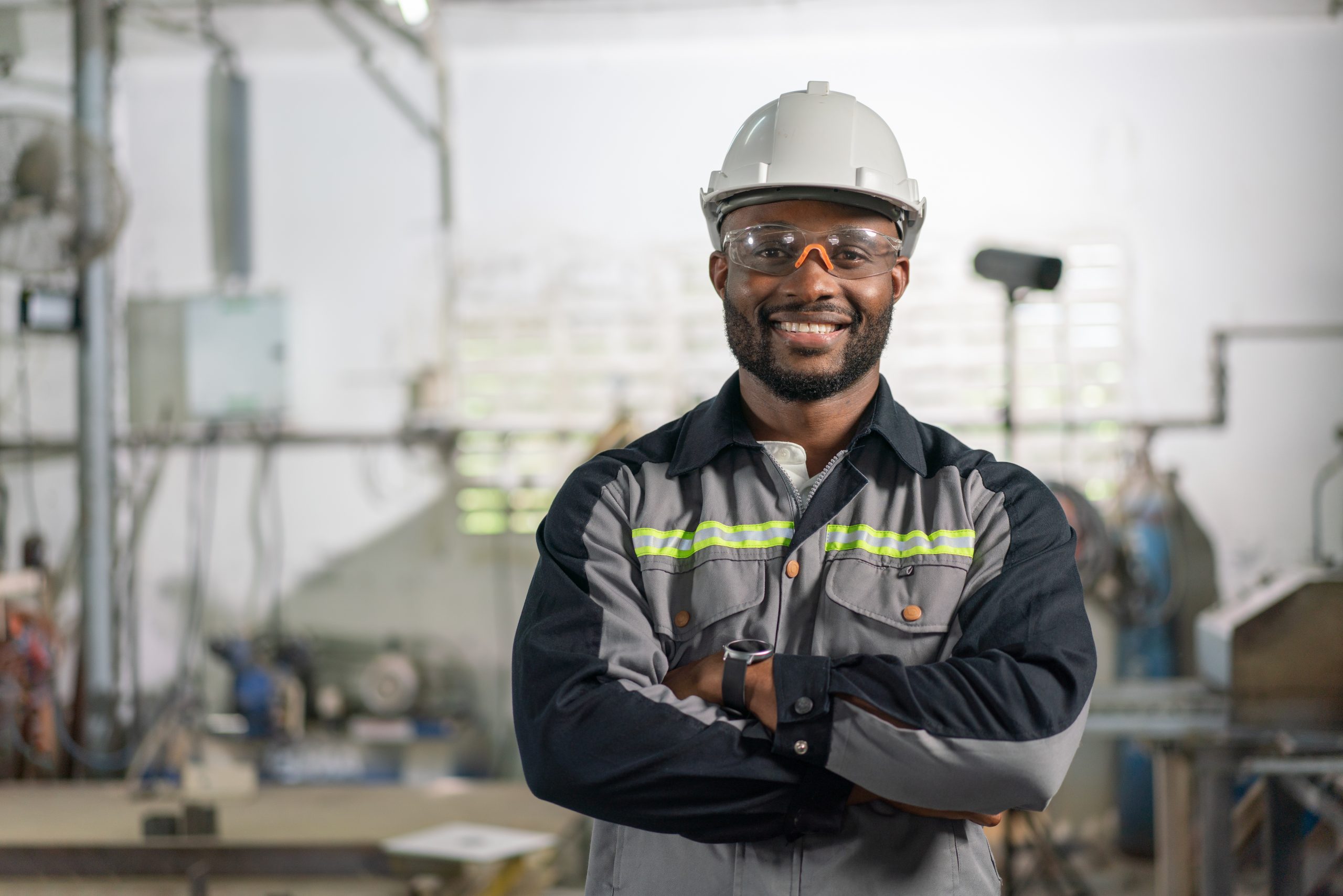 Portrait Of African American Male Engineer In Uniform Smiling An