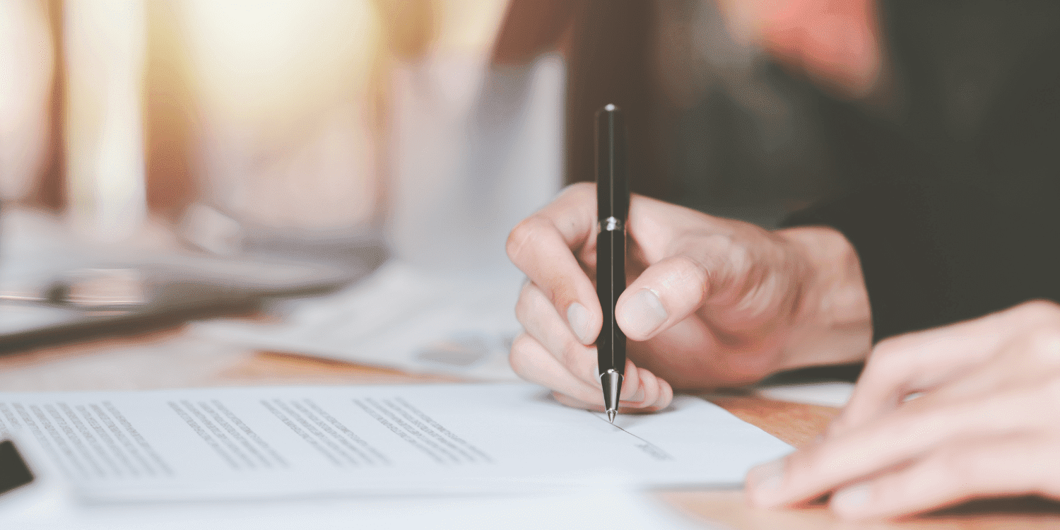 Commercial Contract Business Person Signing A Commercial Contract With A Black Pen 2 Aspect Ratio 1160 580