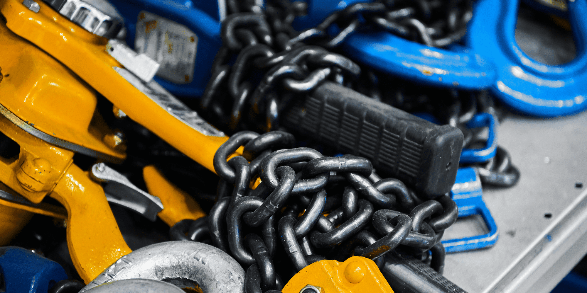 Erecting And Rigging Blue And Orange Equipment And Chains Aspect Ratio 1160 580