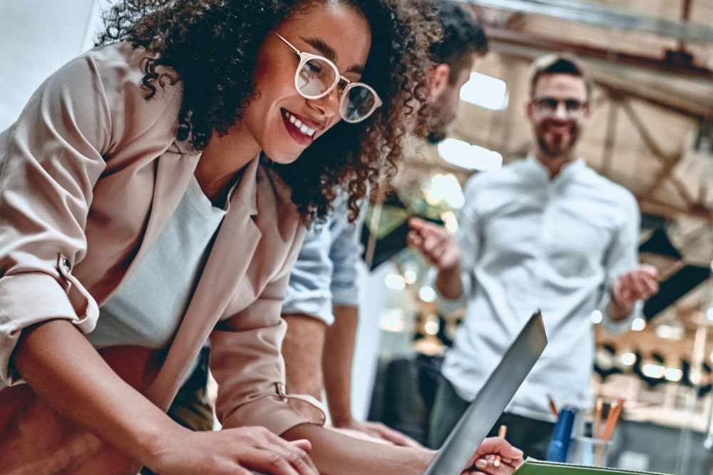Lady In Glasses Working On A Laptop