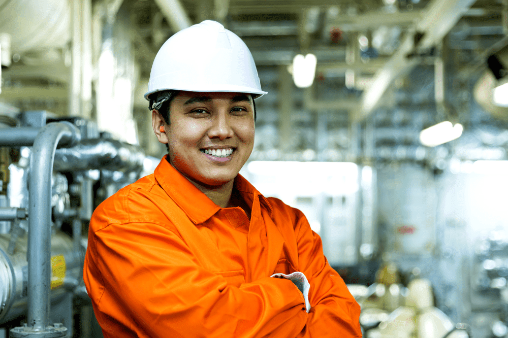 Man Wearing White Hard Had A Orange Overalls Smiling Aspect Ratio 1200 800