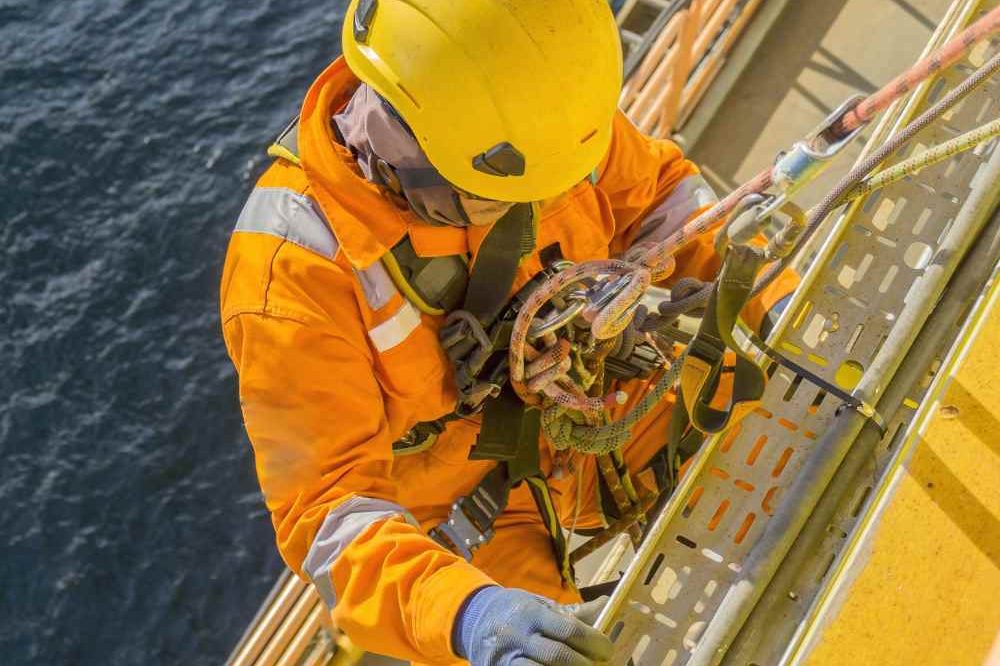 Person Climbing Offshore With Ropes Aspect Ratio 1200 800
