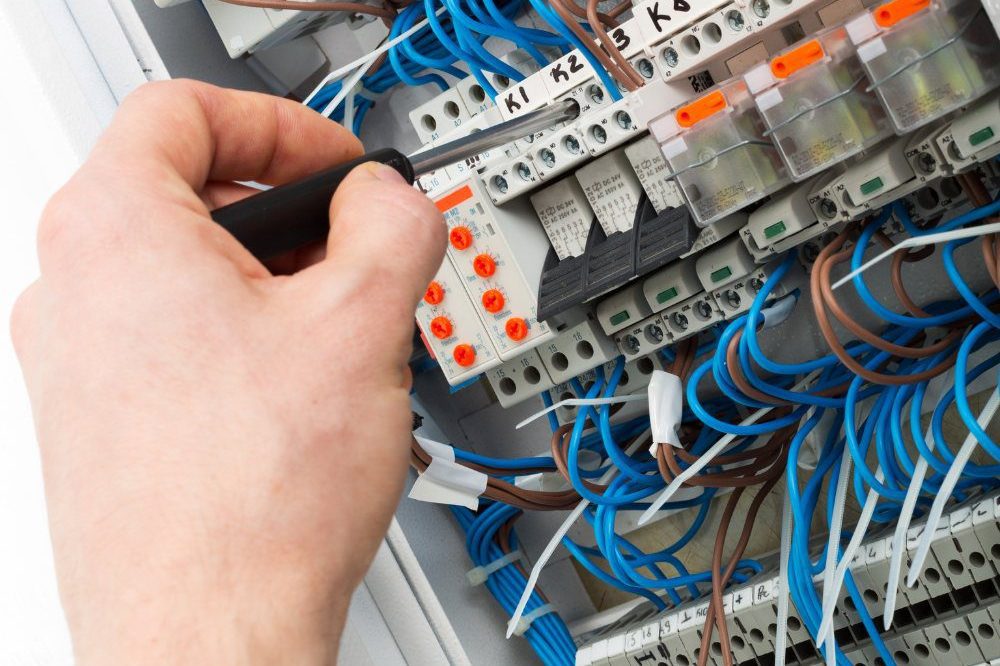 Person Tightening Screw On Consumer Unit Aspect Ratio 1200 800