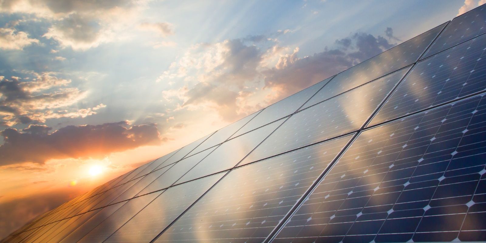 Solar Panels At Sunrise Aspect Ratio 1160 580