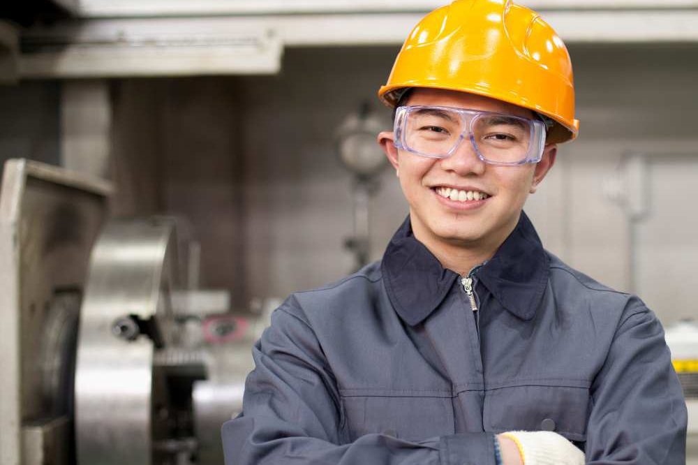Man Smiling In Yellow Hard Hat Aspect Ratio 1200 800
