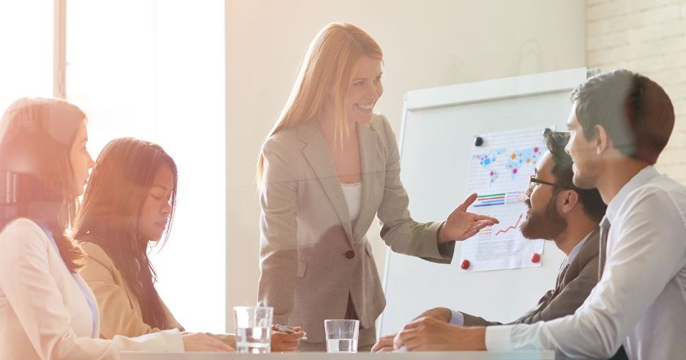 A Person Is Giving A Presentation To A Group Of People