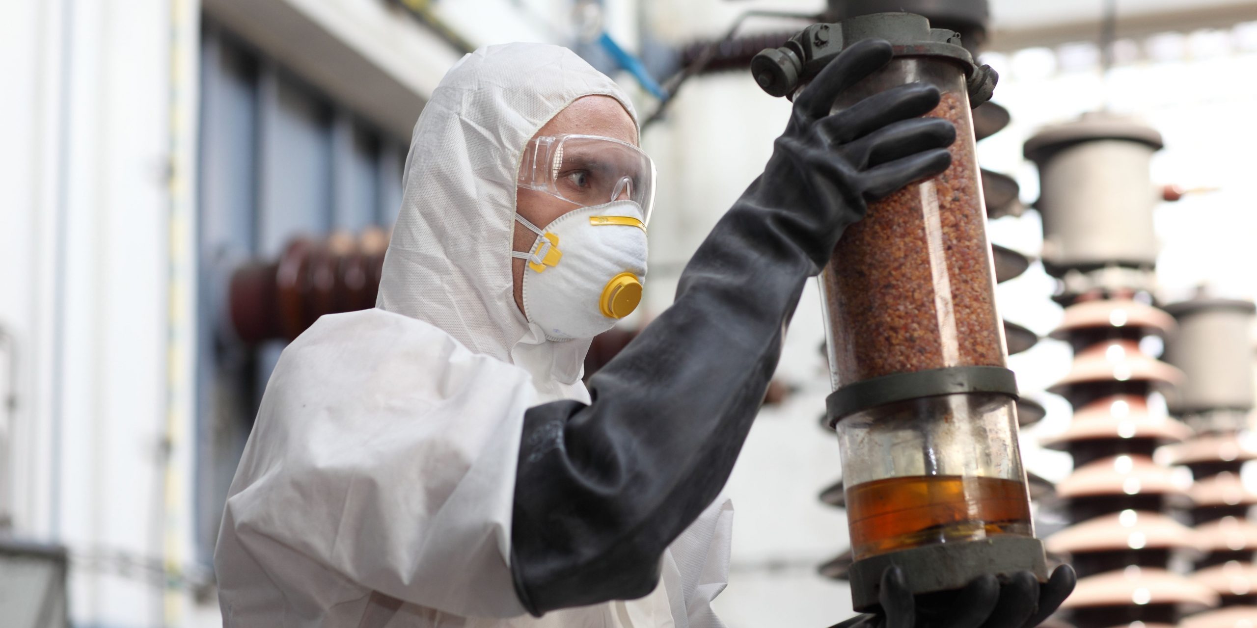 hazardous substances - A Chemical Worker Looking At A Catalyst Container