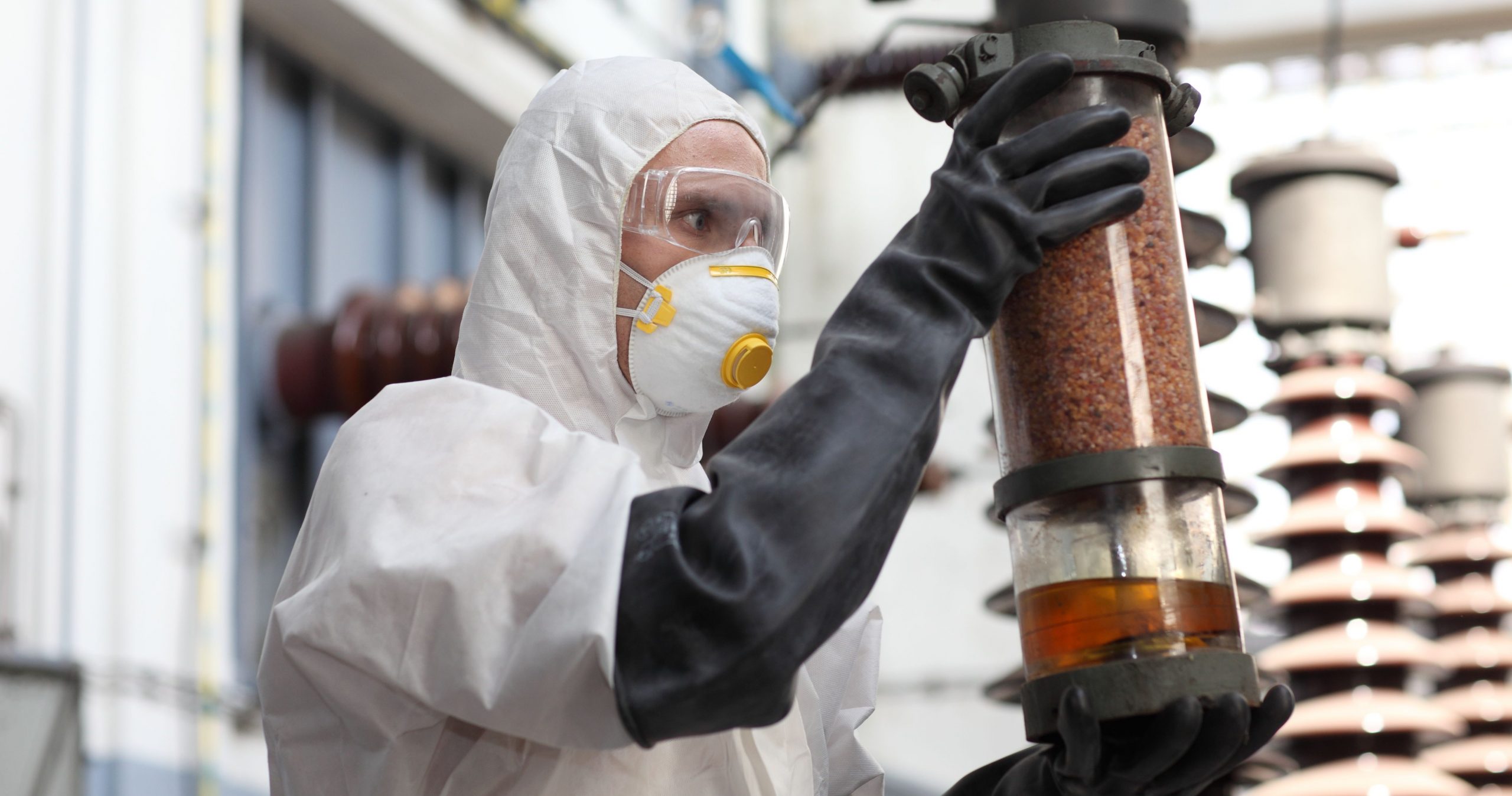 hazardous substances - A Chemical Worker Looking At A Catalyst Container