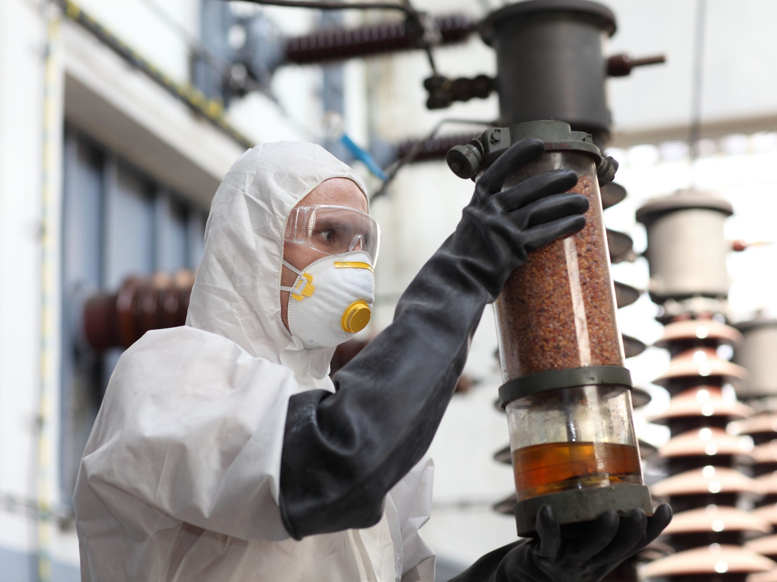 hazardous substances - A Chemical Worker Looking At A Catalyst Container