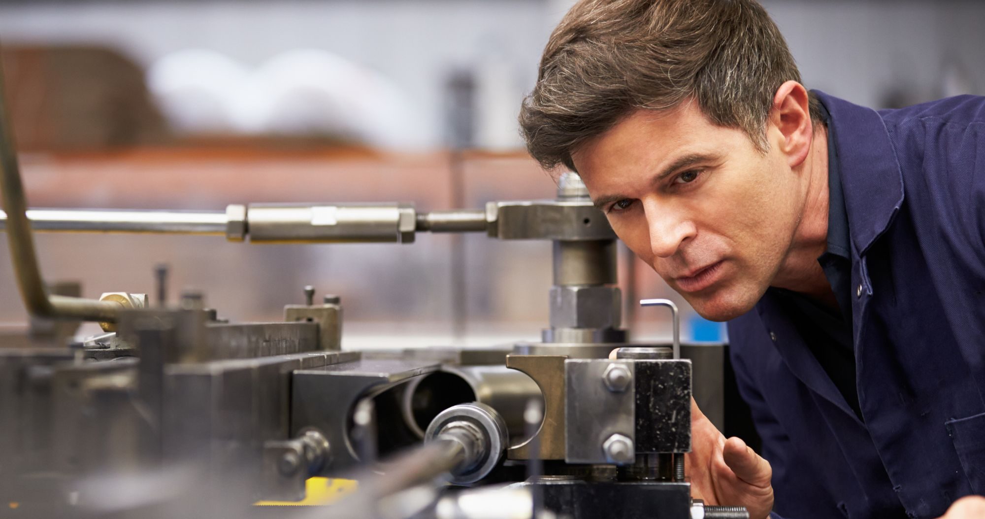 Factory Engineer Operating Hydraulic Tube Bender