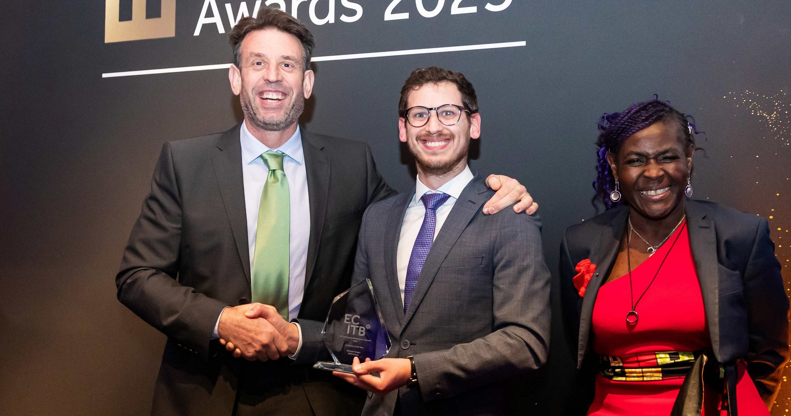 Andy Buckworth From STATS Group Picking Up The Graduate Award For His Employee Michael Horgan