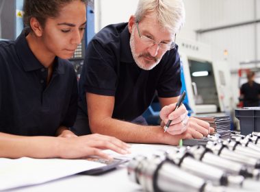 Engineer And Apprentice Planning CNC Machinery Project
