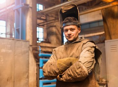 Welder with arms crossed