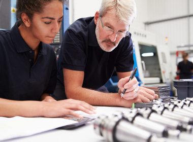 Engineer And Apprentice Planning CNC Machinery Project